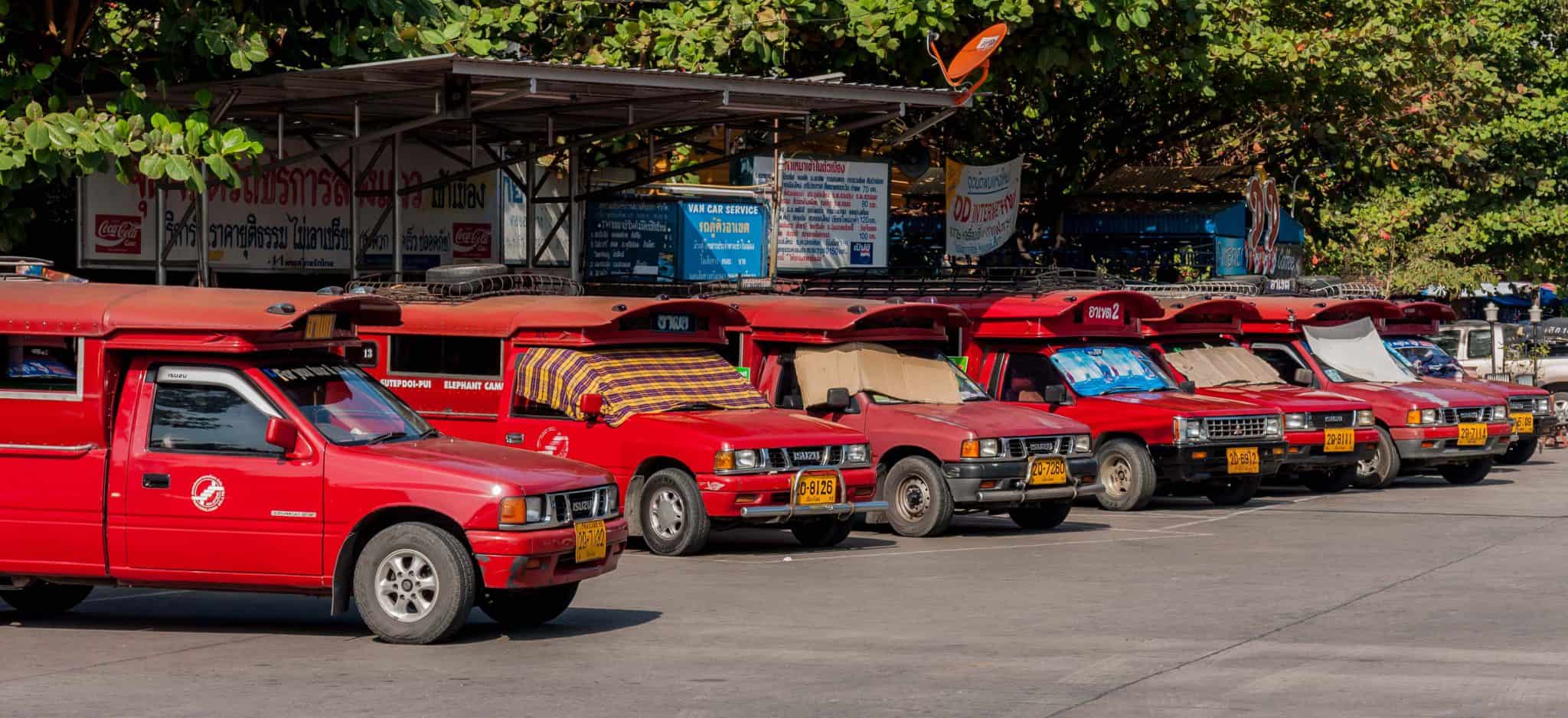 Songthaews lined up outside of Chiang Mai's bus station