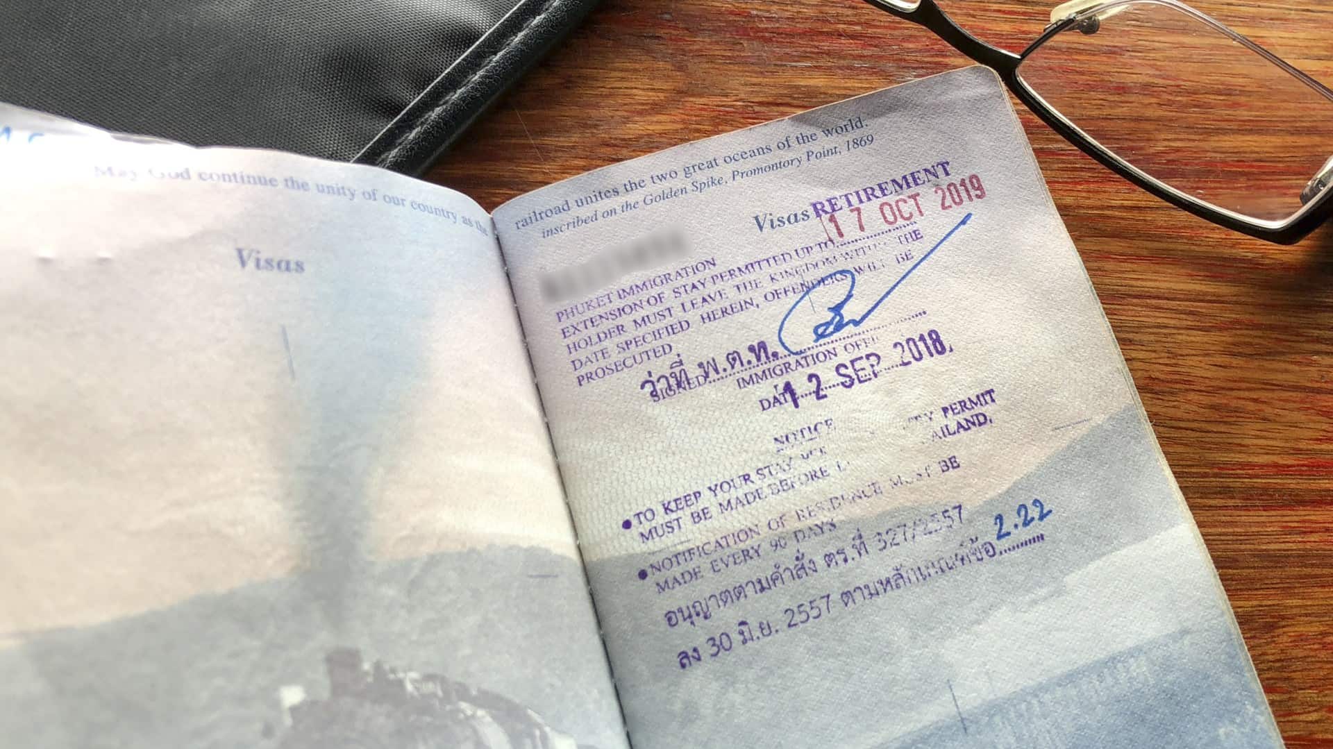 A copy of a passport page with a Thai retirement visa stamp