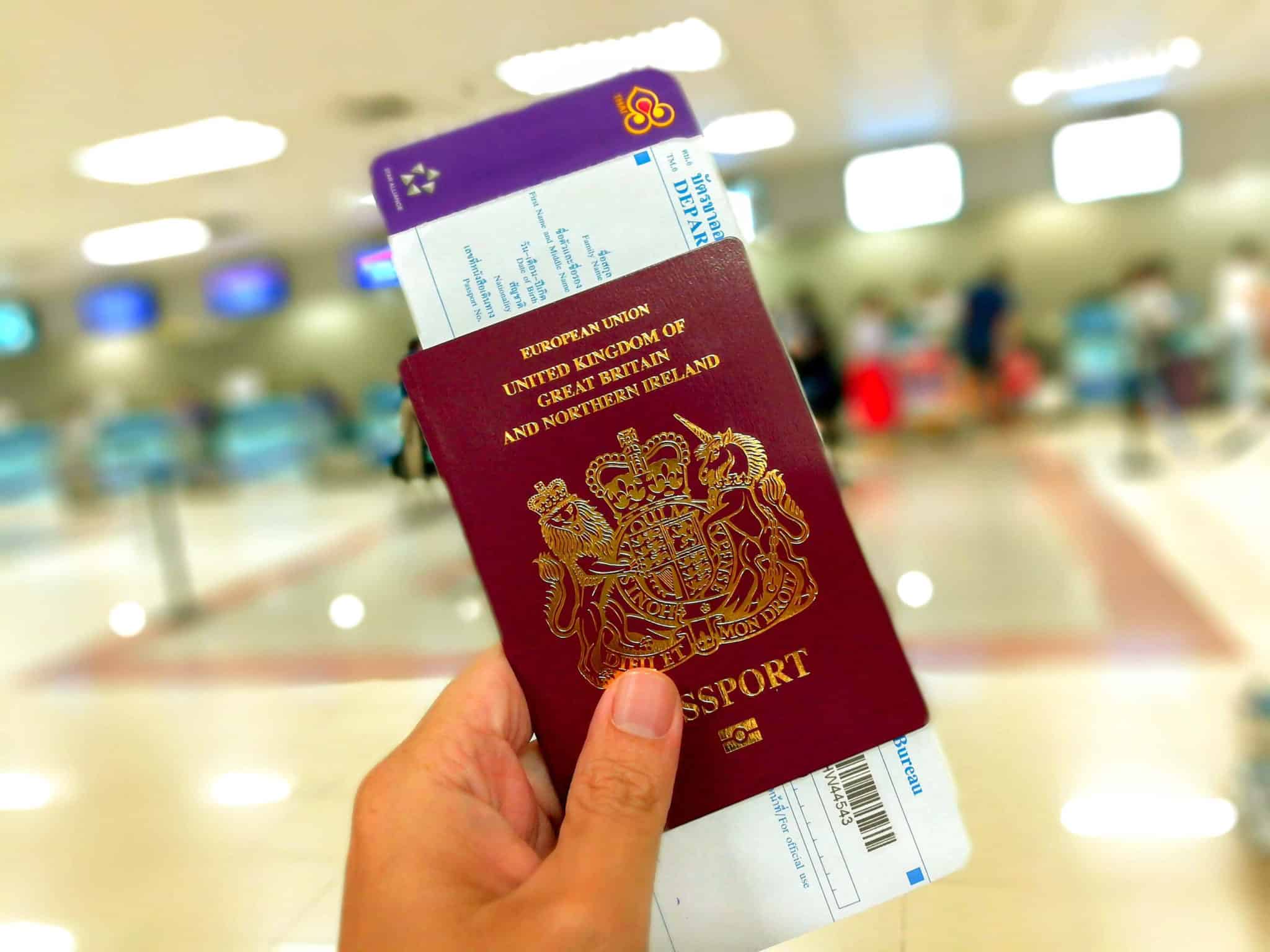 A copy of a british passport with a Thai boarding pass